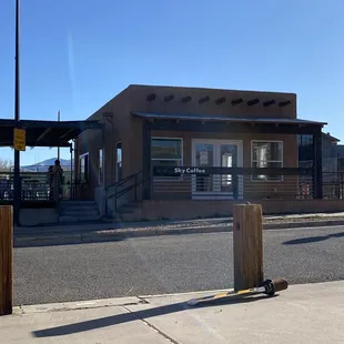 a coffee shop on the corner of a street