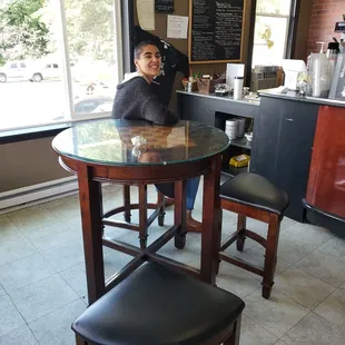 a woman sitting at a table