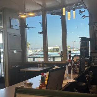 Diner counter. Good view of the planes!