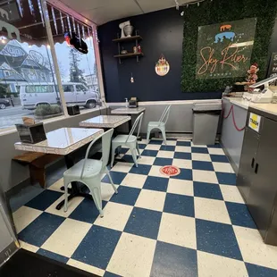 a checkered floor and a view of the outside of the restaurant