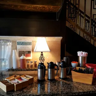 Coffee condiments by the door.