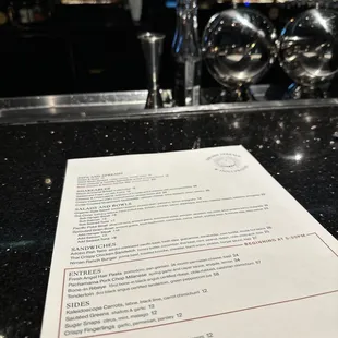 a menu on a bar counter