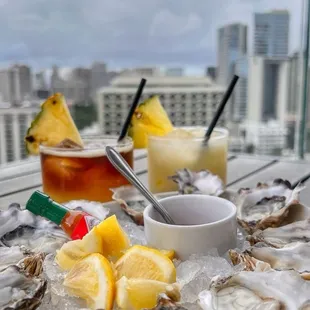 a platter of oysters and pineapples