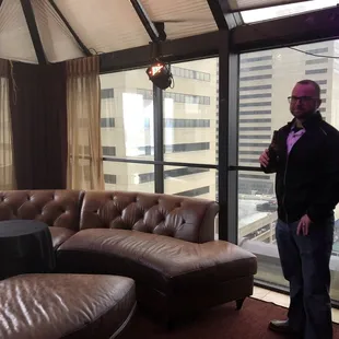 a man standing in front of a large window