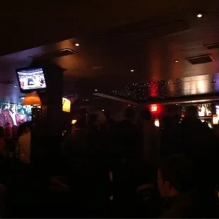 a crowd of people at a bar