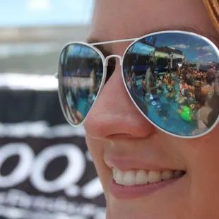 the reflection of a woman in sunglasses