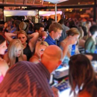 a large group of people at a bar