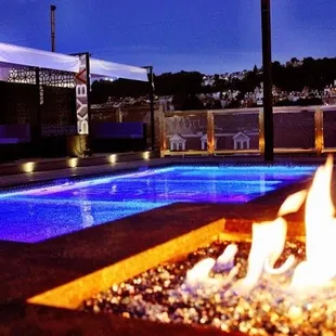 a pool with a fire pit