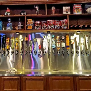 a row of beer taps
