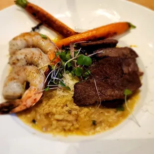 Surf n Turf:  skewered tiger shrimp, top sirloin, triple truffle mushroom risotto, and blanched carrots