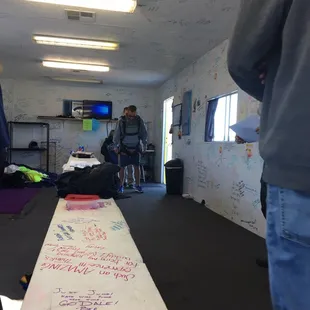 The boyfriend getting harnessed in