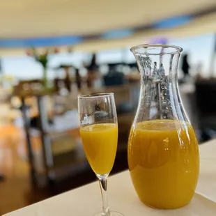 Bottomless, mimosas are served in a carafe