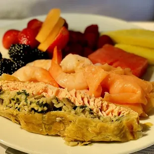 a plate of food with fruit