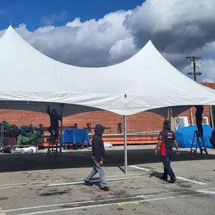 Need a festival tent? We've got 'em! Skye guys cleaning them up before sending them out.