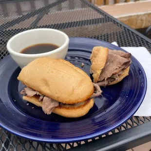 a roast beef sandwich with a side of coffee