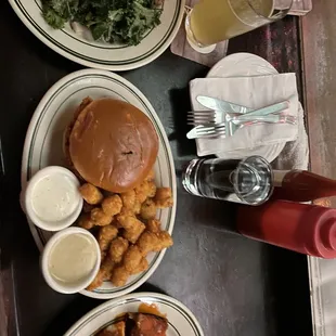 a table with plates of food and drinks