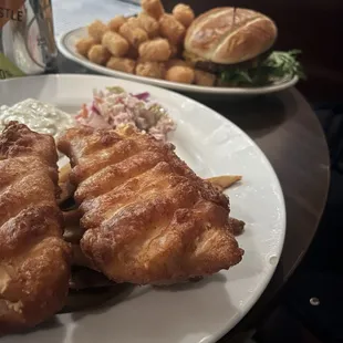 Fish fry in front. Cheeseburger with tater tots in back