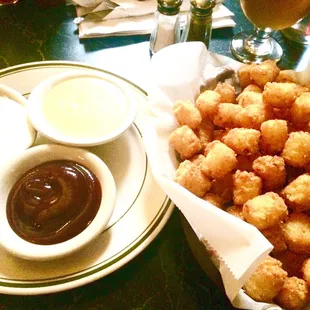 Their &apos;tots are to DIE FOR. Order them with three dipping sauces (ranch, honey-mustard, BBQ)