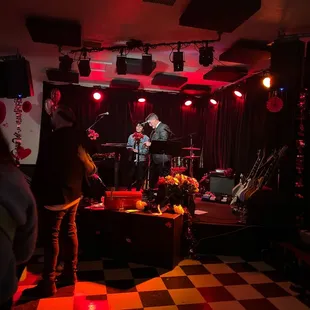 a band playing in a dimly lit room