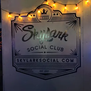 a sign with string lights
