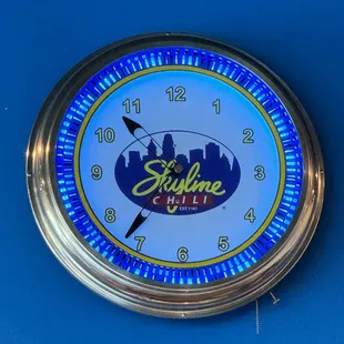 a clock with the skyline logo on it