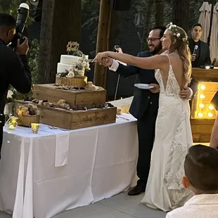 The bride and groom cutting the cake.