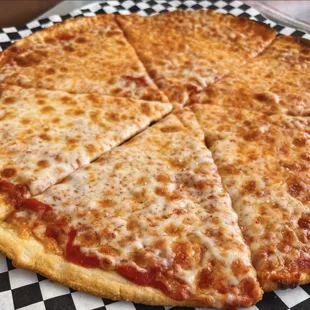 a cheese pizza on a checkered plate