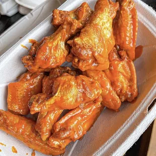 chicken wings in a styrofoam container