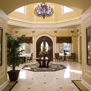 a foyer with a chandelier