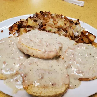 a plate of food with gravy and potatoes
