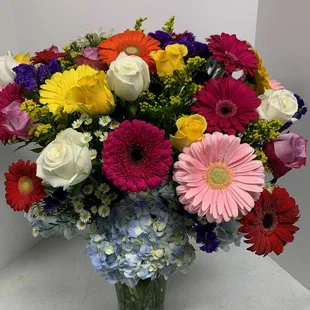 Colorful assorted flowers arranged. Let us make something wonderful for you!