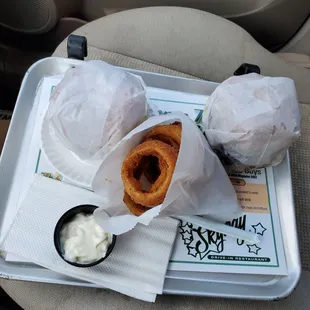 2 burgers, onion ring, sky hi sauce and a cola.