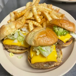 three cheeseburgers and french fries