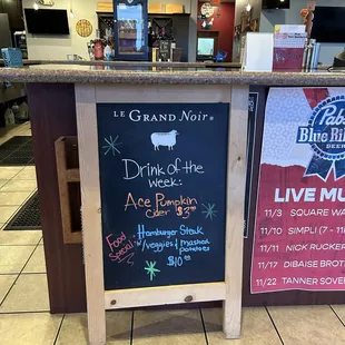 a chalkboard sign in a restaurant