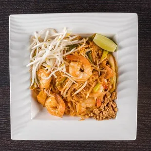 Pad Thai.                                          Pan fired rice noodle with egg,tofu,bean sprouts,peanuts and choice of protein