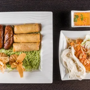 SLK Sampler.Thai or lao style papaya salad，lao sausages,egg rolls and money bags.