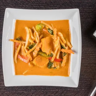 Red curry.                                       Simmered coconut milk in red curry paste,bell pepper,bamboo shoots with choice of protein