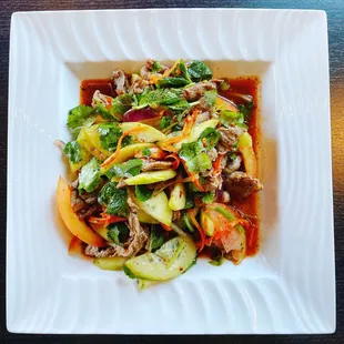 Yum Nuer salad.           Beef salad with tomatoes and cucumbers in house vinaigrette.