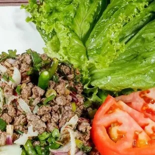 Laap Salad.Choice of protein with mint，onion，cilantro tossed in roasted rice powder&amp;lime juice