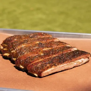 These are out St. Louis Ribs that are seasoned with our homemade rub and smoked with cherry and pecan wood. No sauce needed.