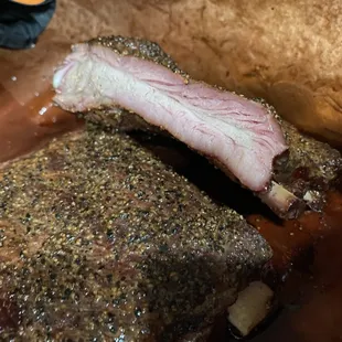 Our ribs are our staple! No sauce needed for these bad boys. I suggest 2 slabs, 1 for now and 1 for later.