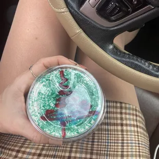 a person holding a cup of coffee