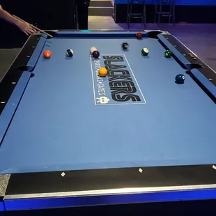 a man playing a game of pool