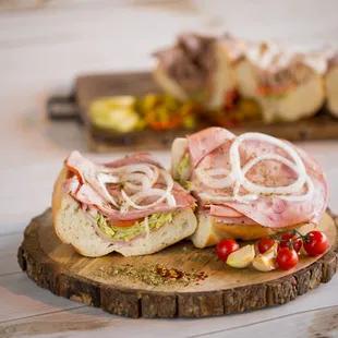 two sandwiches on a wooden board