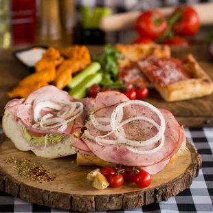 a ham sandwich on a cutting board