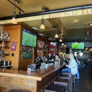 a woman sitting at the bar