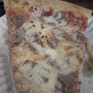 Nice Slice of Cheese Pizza with sausage added.