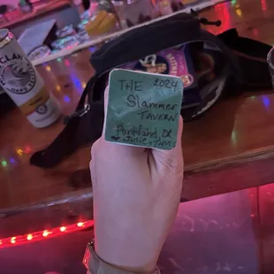 a person holding up a piece of paper