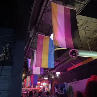 LGBTQ flags over the bar area