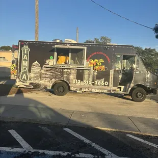 a food truck parked on the side of the road